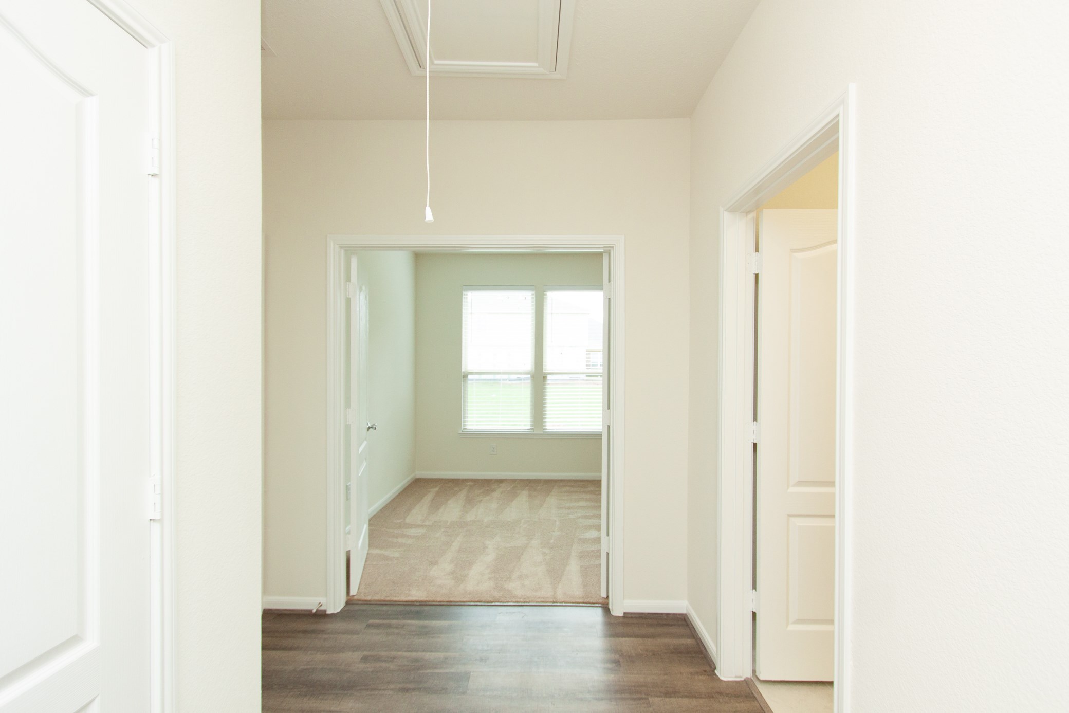 2011 Parnevik Place Conroe, TX 77304 - Photo 10 of 37 This is the hallaway leading to the spacious study/ library.