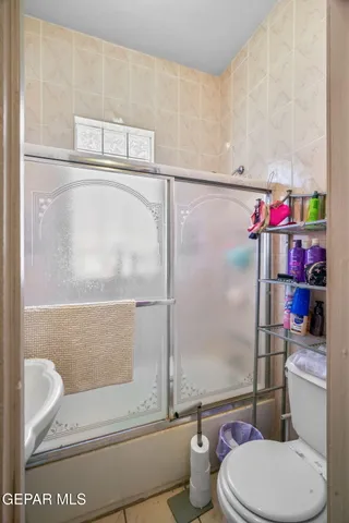 a kitchen with stainless steel appliances a refrigerator and a stove top oven