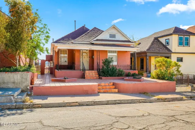 a view of a house with outdoor space and sitting area