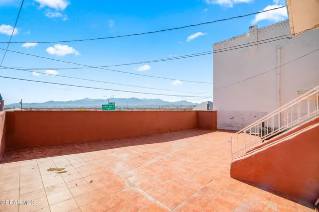 a spacious bathroom with a shower and a sink