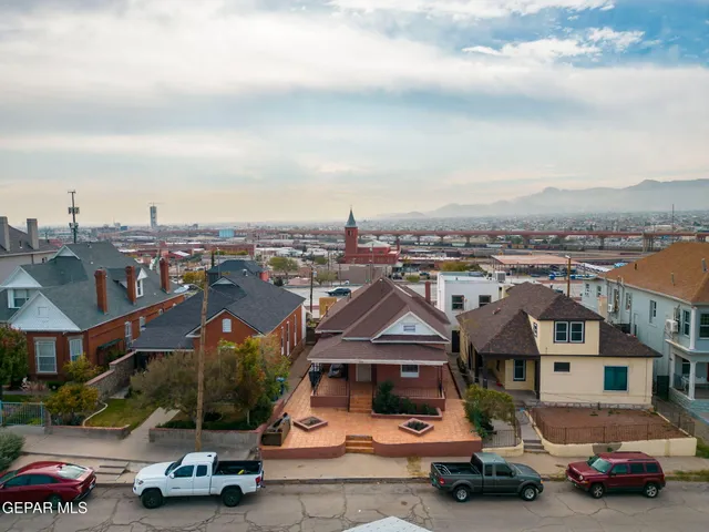 an aerial view of residential houses with outdoor space