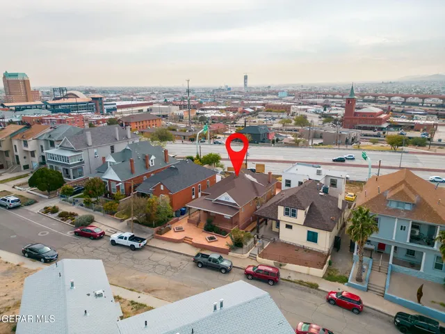 an aerial view of residential houses and city street