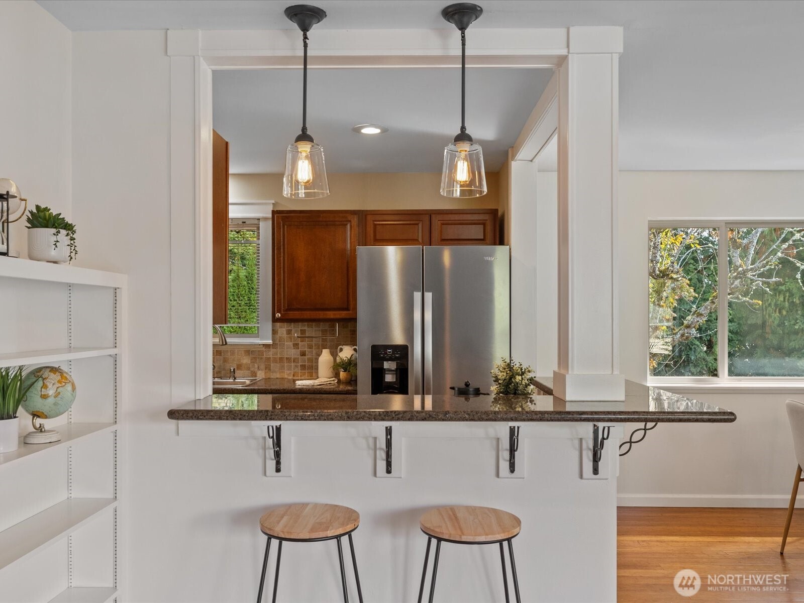 19116 106th Avenue Northeast Bothell, WA 98011 - Photo 11 of 40 a view of a kitchen island a chandelier furniture and windows