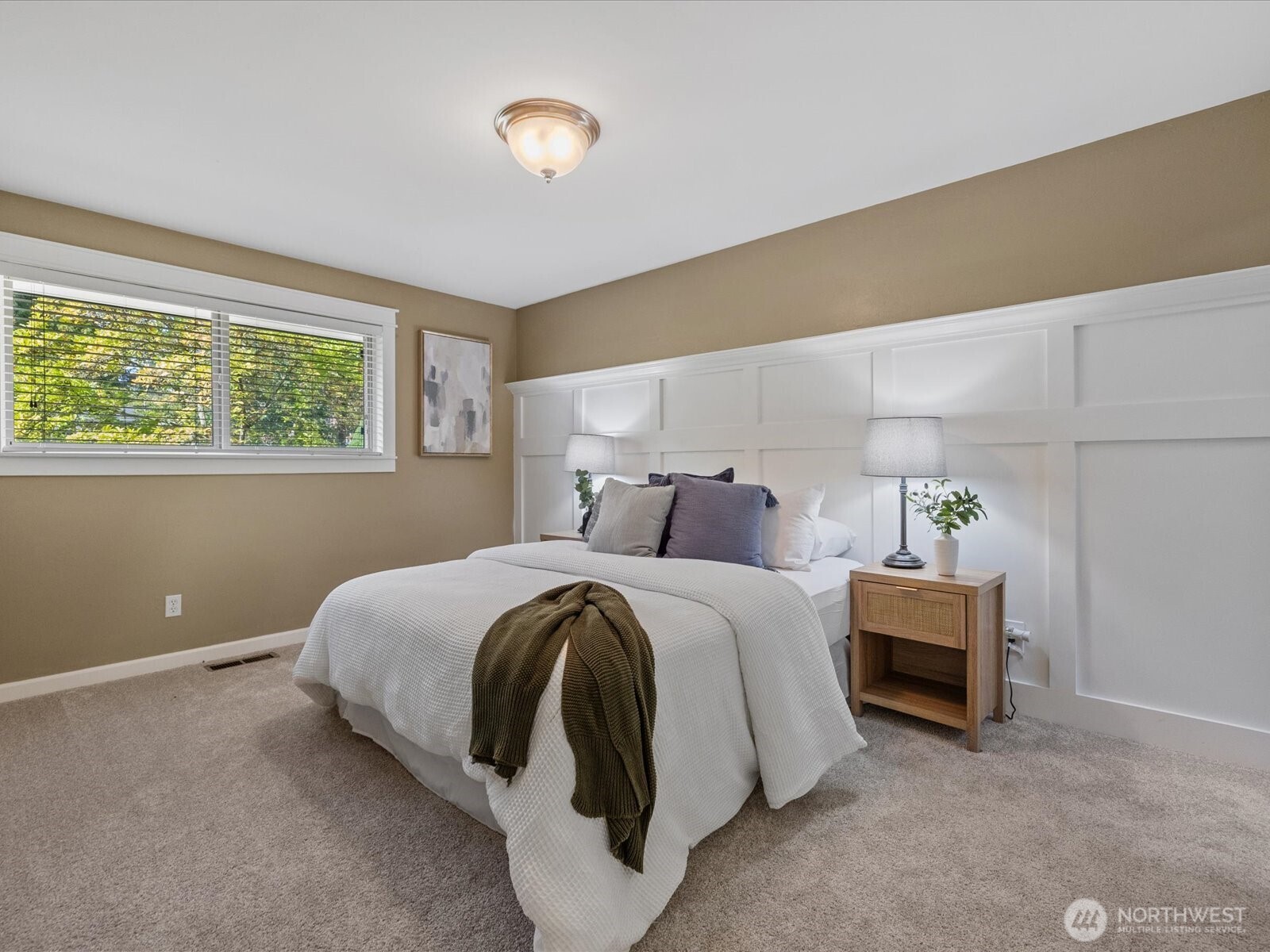 19116 106th Avenue Northeast Bothell, WA 98011 - Photo 17 of 40 a bed room with a bed and a chair