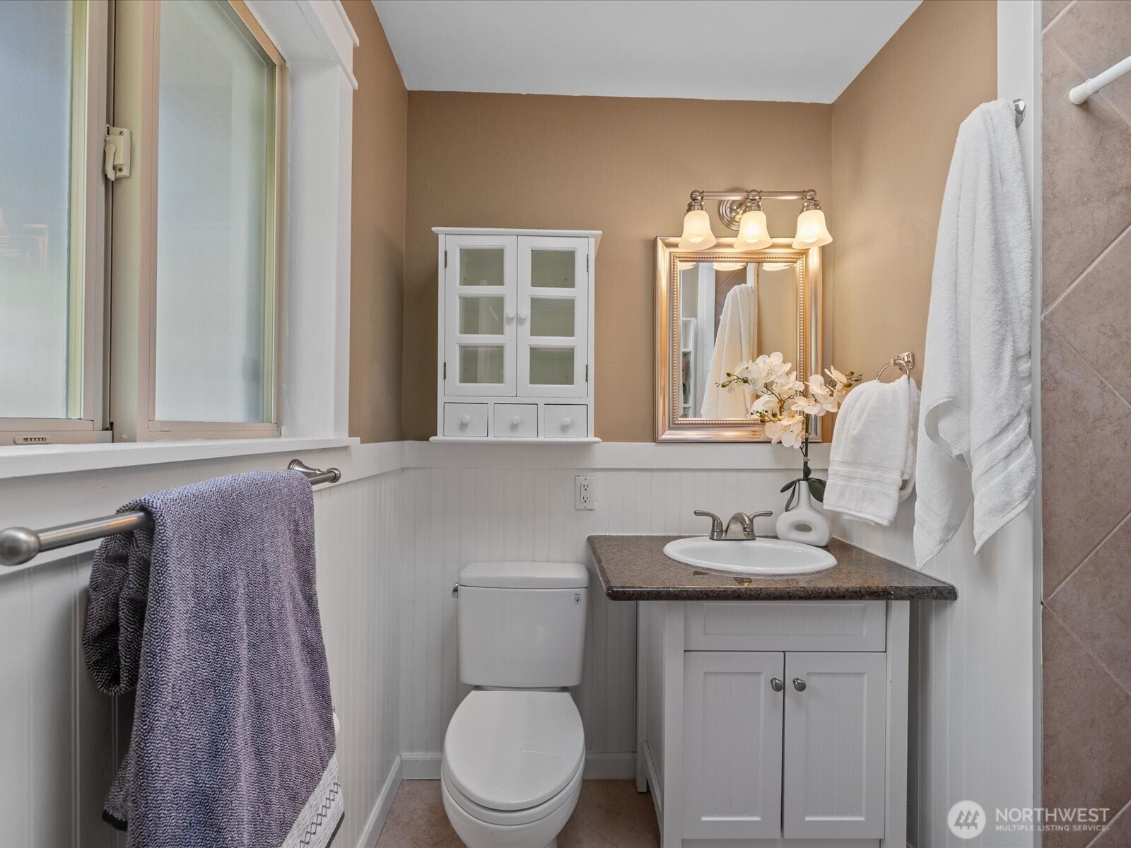 19116 106th Avenue Northeast Bothell, WA 98011 - Photo 18 of 40 a bathroom with a sink vanity mirror and toilet