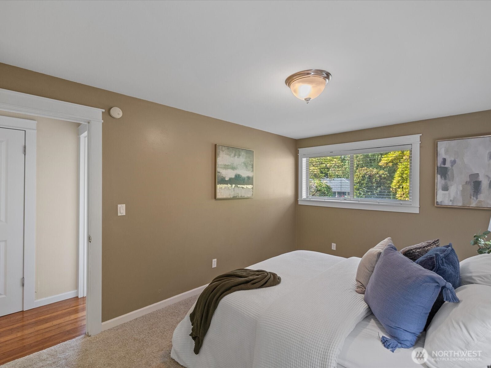 19116 106th Avenue Northeast Bothell, WA 98011 - Photo 19 of 40 a bedroom with a bed and a window
