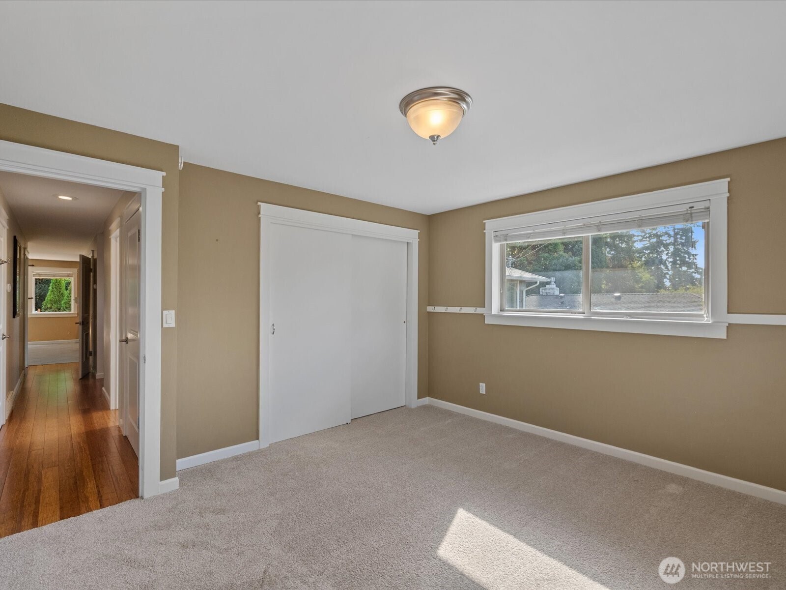 19116 106th Avenue Northeast Bothell, WA 98011 - Photo 21 of 40 a view of an empty room with wooden floor