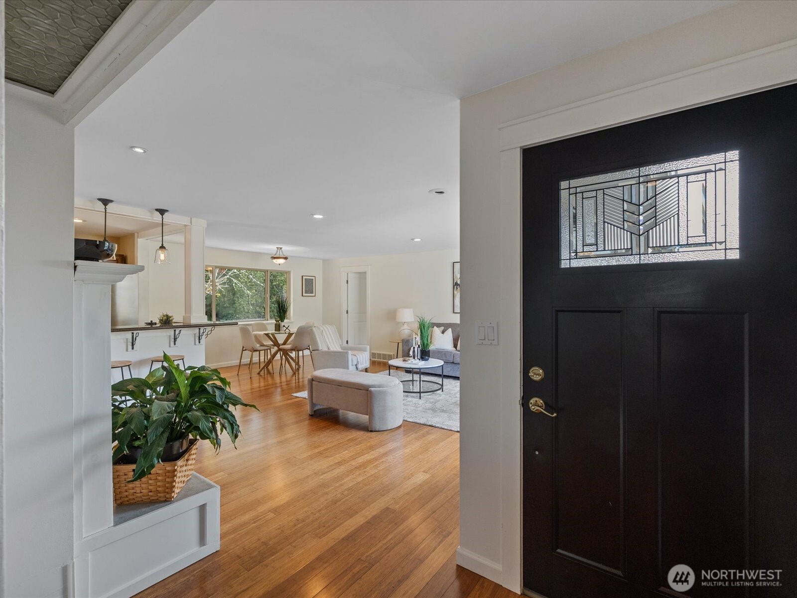 19116 106th Avenue Northeast Bothell, WA 98011 - Photo 4 of 40 a living room with furniture and a large window