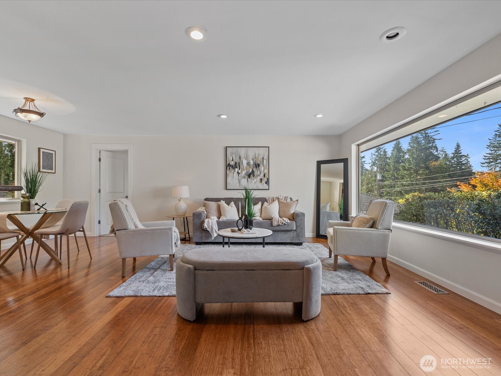 19116 106th Avenue Northeast Bothell, WA 98011 - Photo 6 of 40 a living room with fireplace furniture and a large window