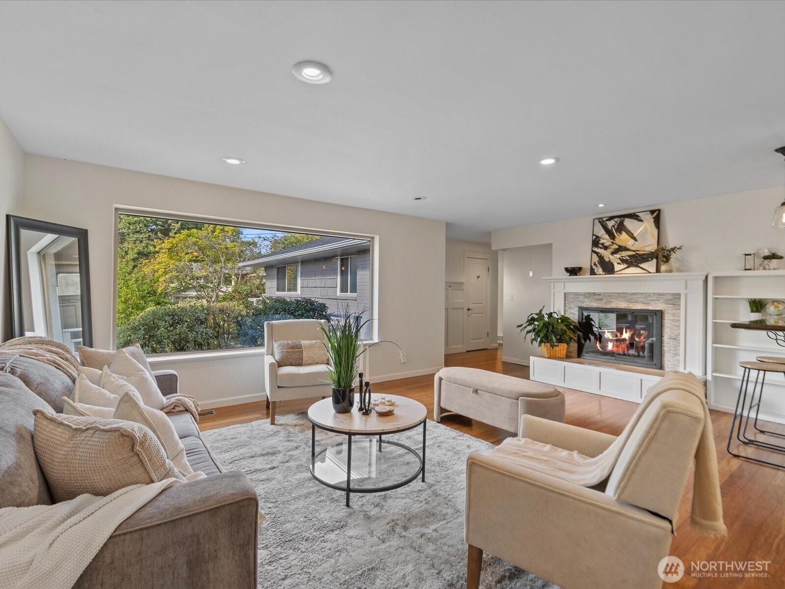 19116 106th Avenue Northeast Bothell, WA 98011 - Photo 9 of 40 a living room with fireplace furniture and a large window