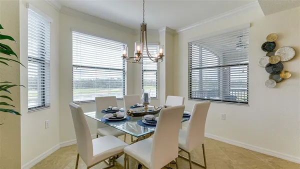 a view of a dining room with furniture and windows