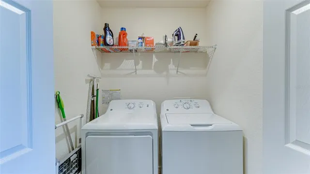 a utility room with dryer and washer