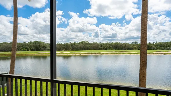 a view of a swimming pool with a table and chairs