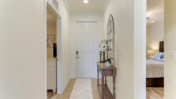 a view of hallway with livingroom and stairs