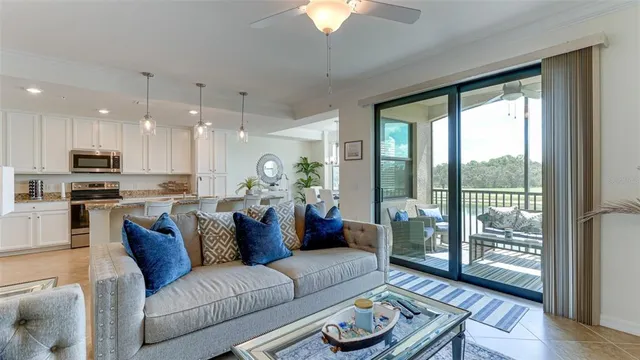 a view of living room kitchen with furniture and wooden floor