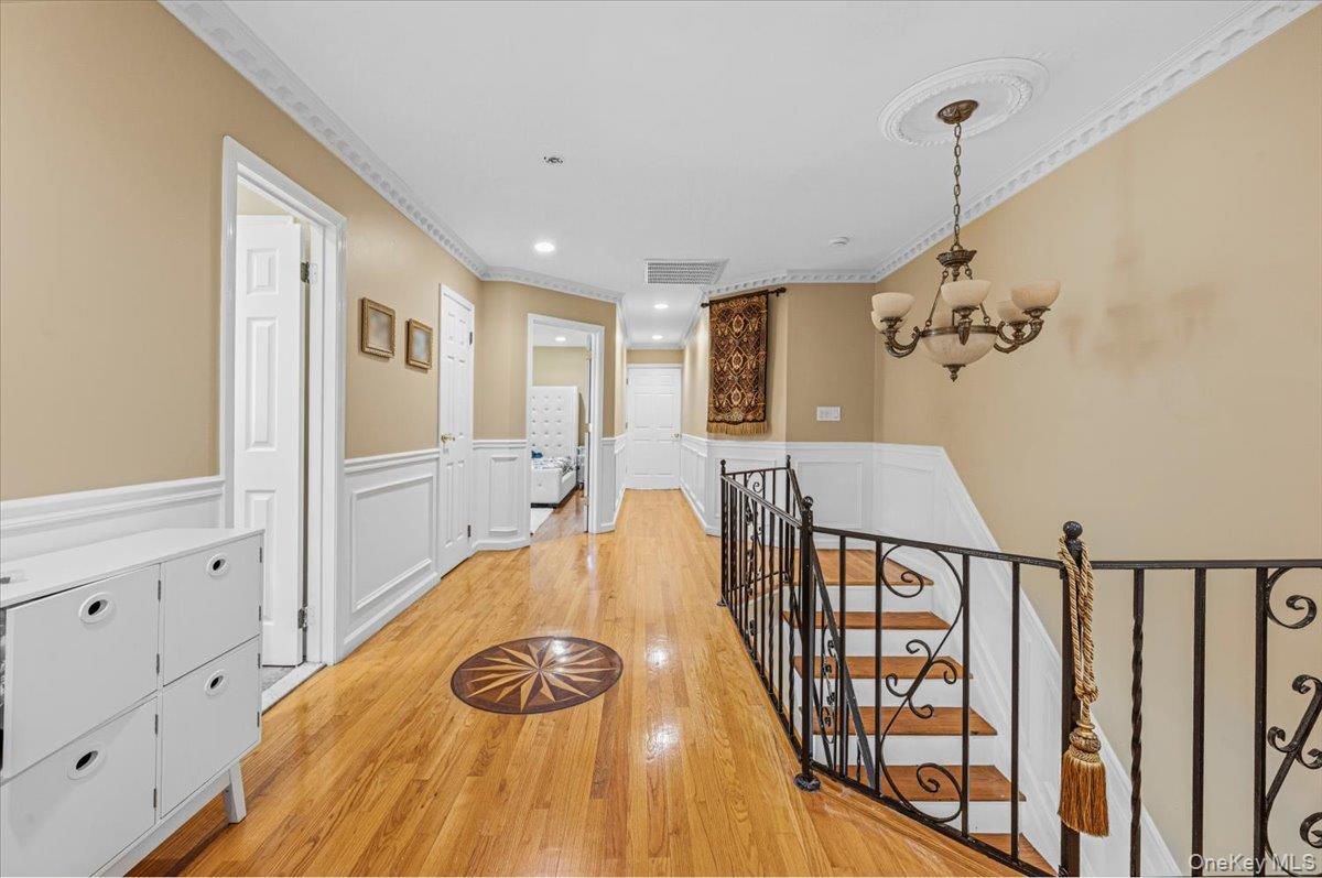 626 Caledonia Road Dix Hills, NY 11746 - Photo 29 of 49 a view of a bedroom with furniture window and wooden floor