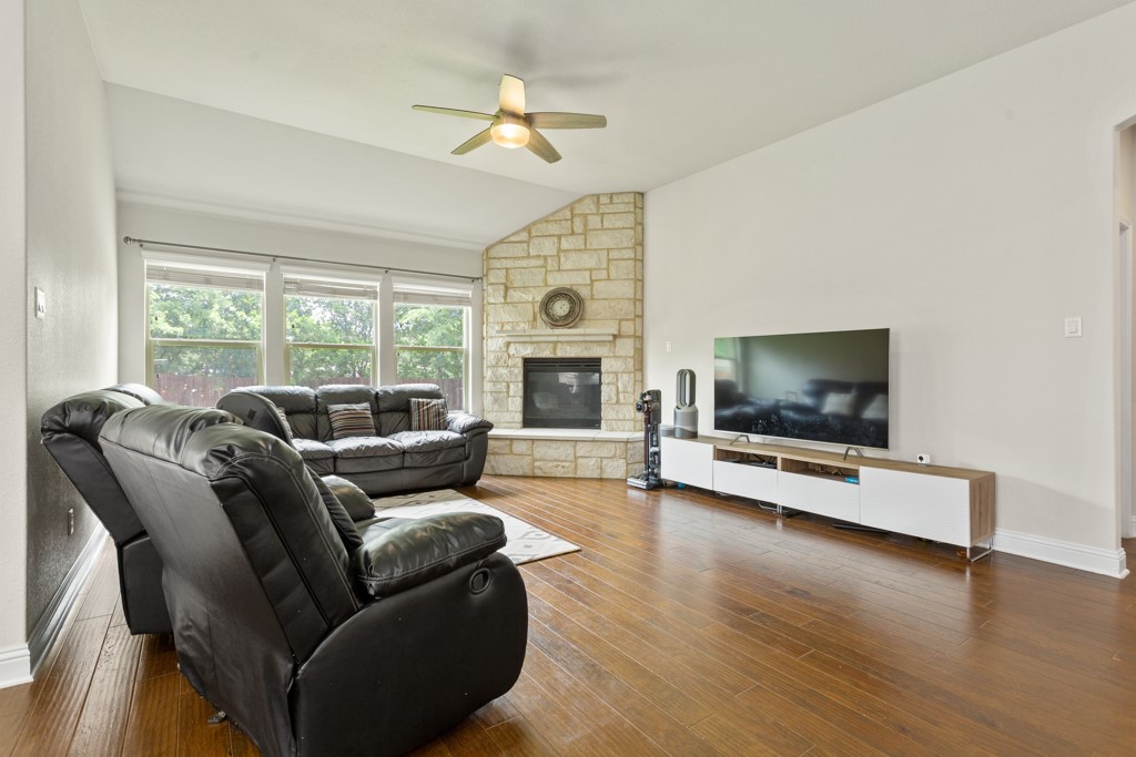 1916 Elaina Loop Leander, TX 78641 - Photo 6 of 23 a living room with furniture fireplace and a flat screen tv