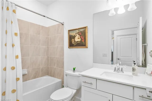 a bathroom with a sink a toilet and bathtub