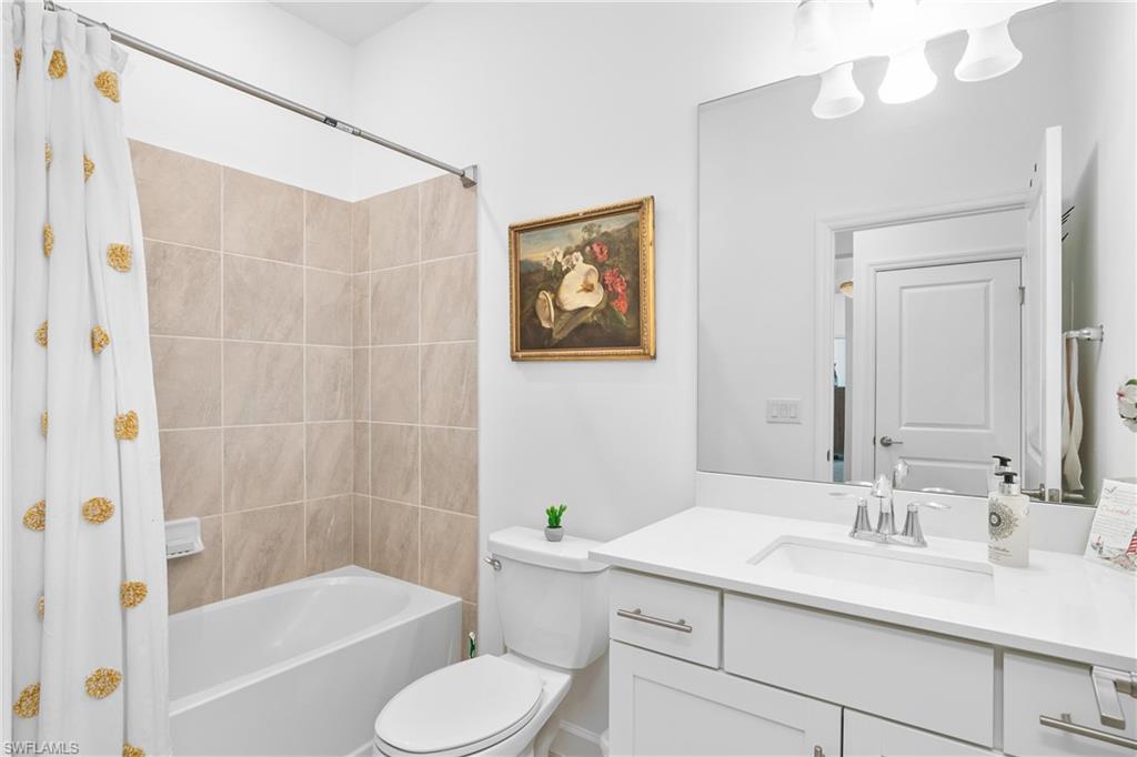 20072 Napa Loop Estero, FL 33928 - Photo 12 of 41 a bathroom with a sink a toilet and bathtub