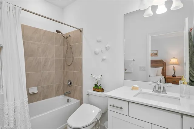 a bathroom with a sink a toilet and a bathtub