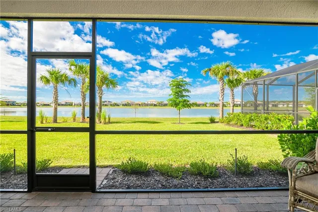 a view of a swimming pool with an outdoor space and seating area