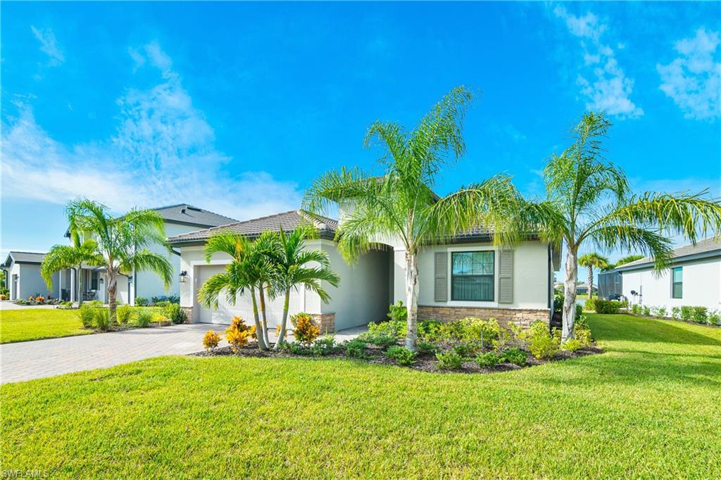 20072 Napa Loop Estero, FL 33928 - Photo 2 of 41 a view of a house with backyard and a tree
