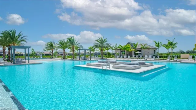 swimming pool view with a outdoor seating