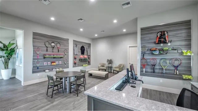 a room with pool table and windows
