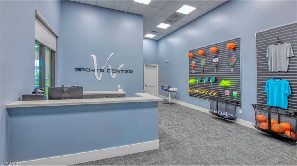 20072 Napa Loop Estero, FL 33928 - Photo 35 of 41 a living room with furniture and a flat screen tv
