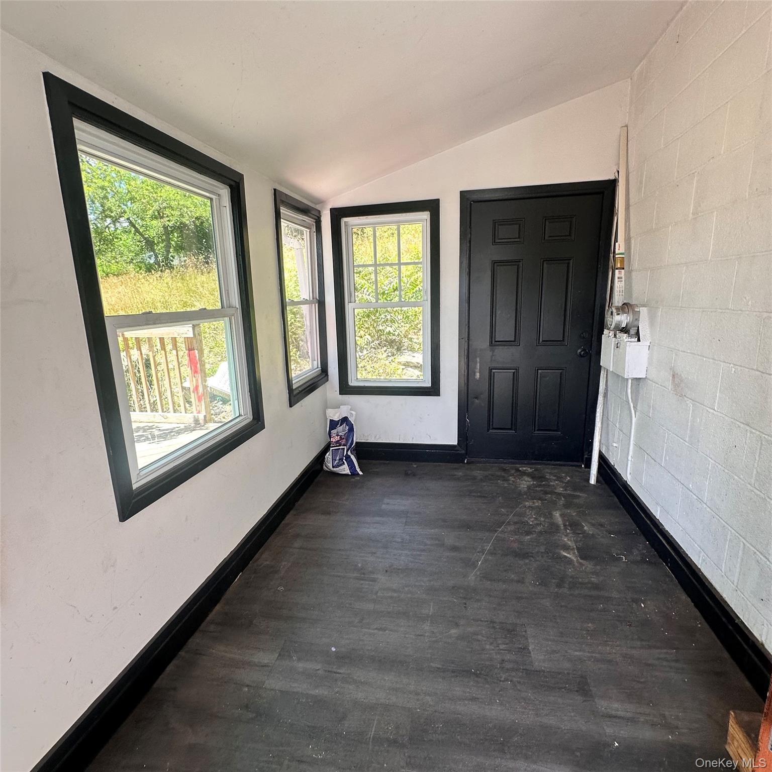 152 Smith Street, Unit 2 Poughkeepsie, NY 12601 - Photo 2 of 8 Entry foyer. Vinyl floor, access to back yard.