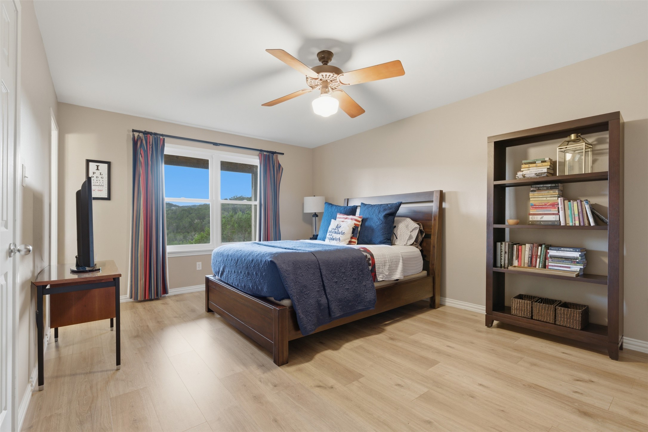 1504 Twilight Ridge Drive Austin, TX 78746 - Photo 23 of 30 Downstairs bedroom has a big closet, en suite bath - and a great story of a deer shot from the window.