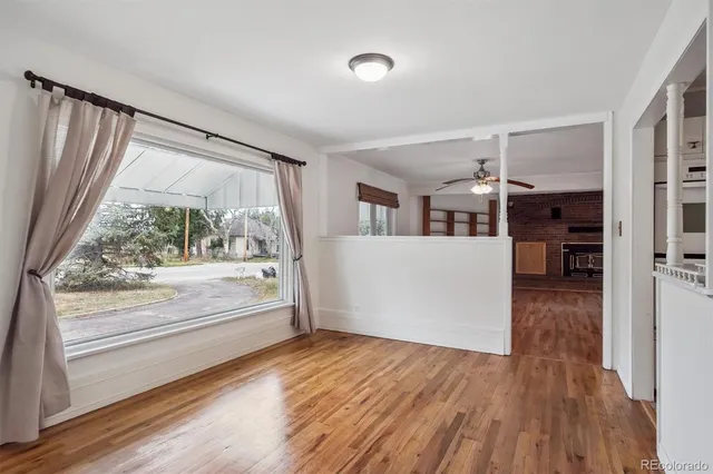 a view of a kitchen with wooden floor and a kitchen