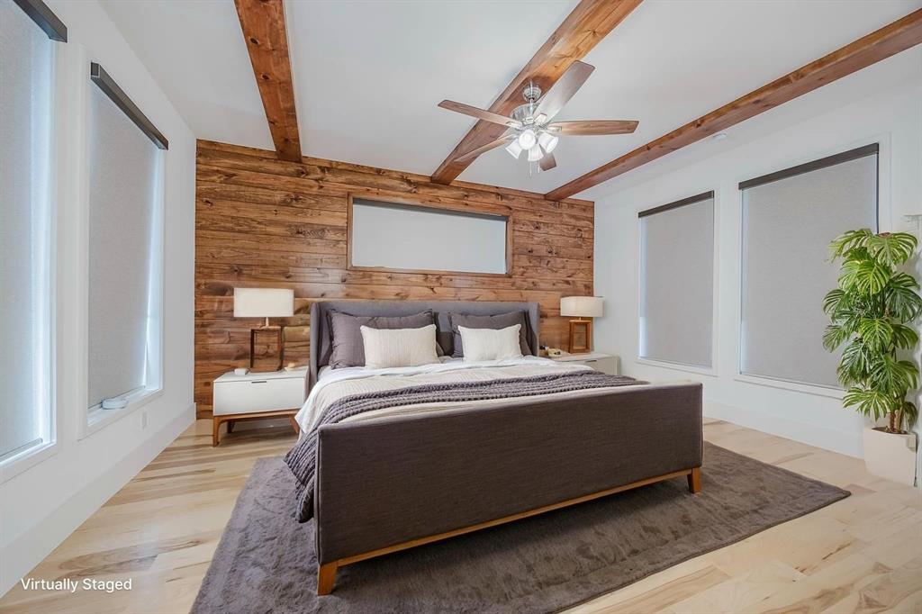2081 Holt Way Grapevine, TX 76051 - Photo 17 of 40 a bed room with a bed and a potted plant