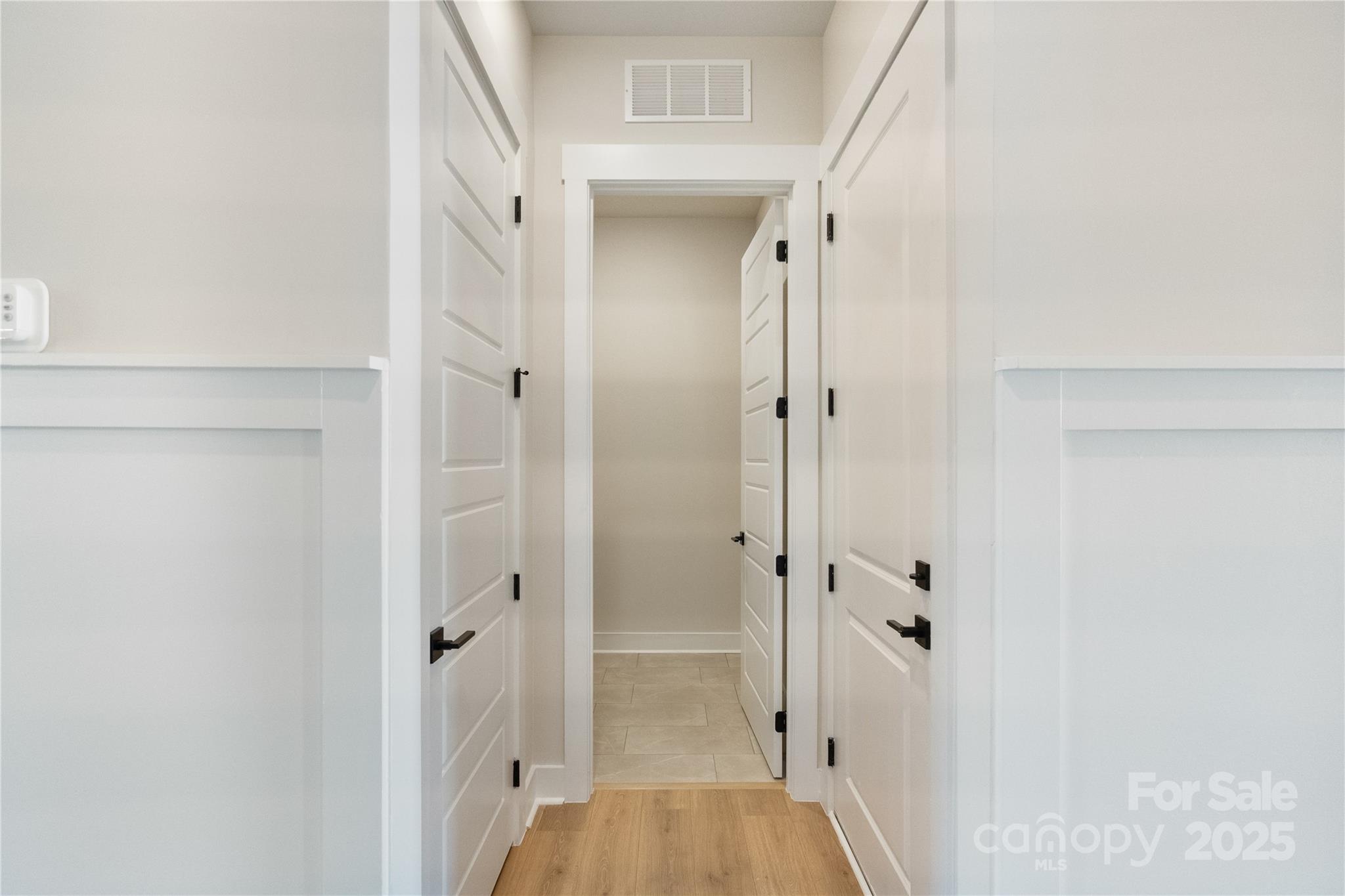 2085 Bonds Lane, Unit 26 Fort Mill, SC 29715 - Photo 13 of 41 a view of a hallway with closet and wooden floor