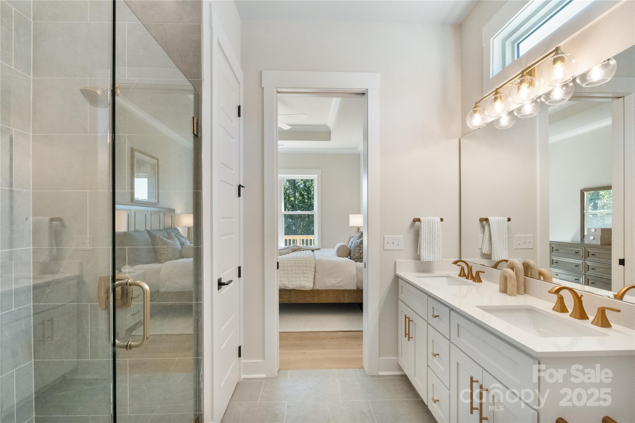 2085 Bonds Lane, Unit 26 Fort Mill, SC 29715 - Photo 28 of 41 a en suite bathroom with a double vanity sink a mirror and a shower