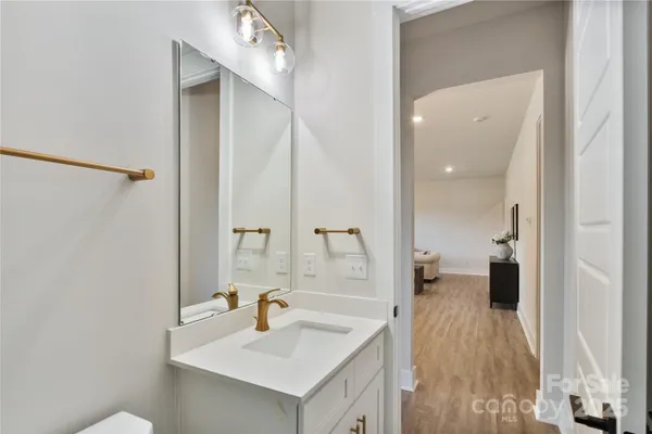a en suite bathroom with a sink and mirror