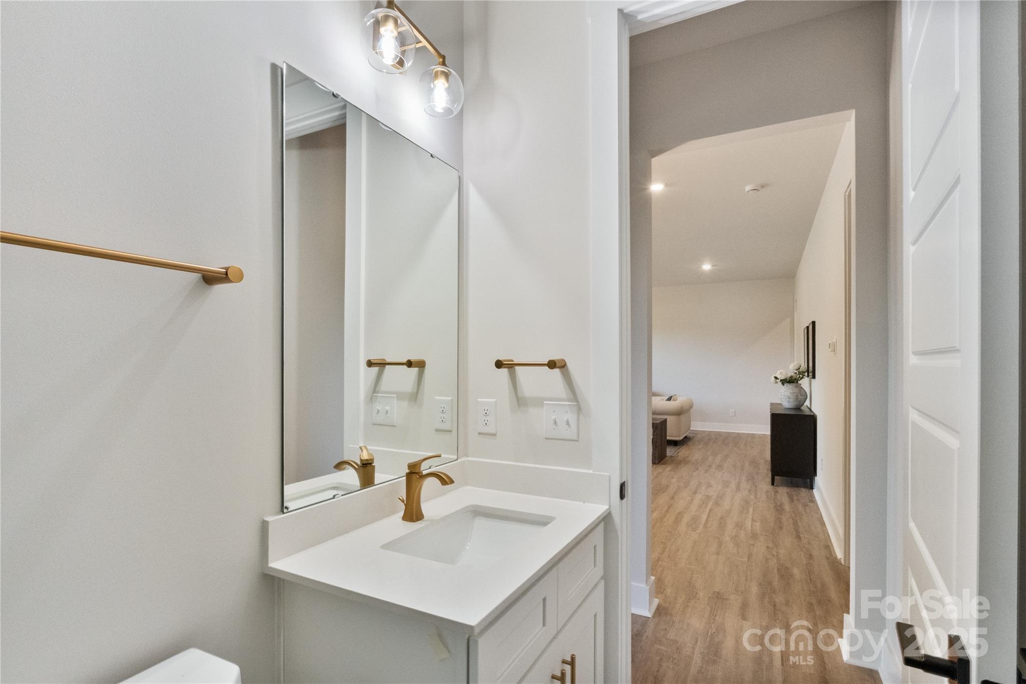 2085 Bonds Lane, Unit 26 Fort Mill, SC 29715 - Photo 39 of 41 a en suite bathroom with a sink and mirror