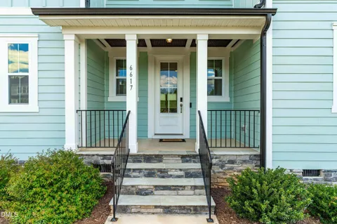 a view of an entryway with wooden floor