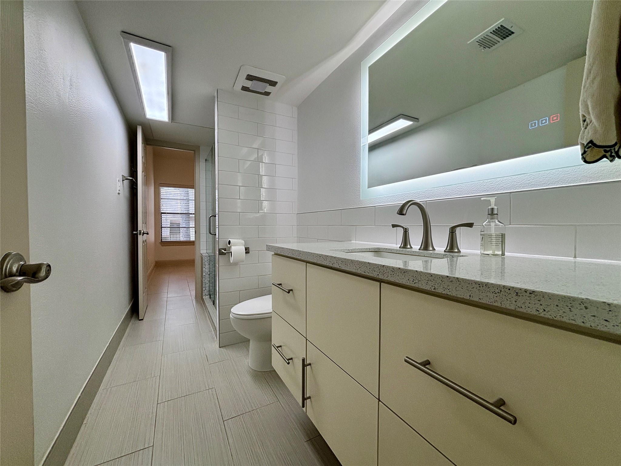 12900 Walden Road, Unit 508E Montgomery, TX 77356 - Photo 15 of 25 a hallway with sink and mirror
