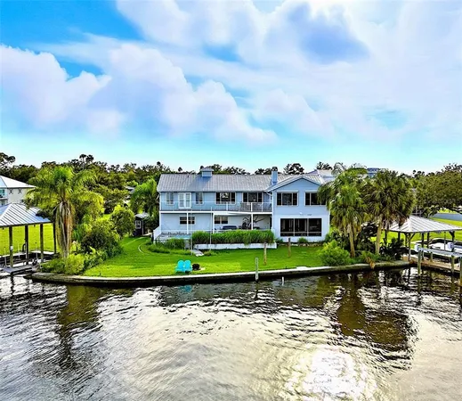 a view of house with a lake view
