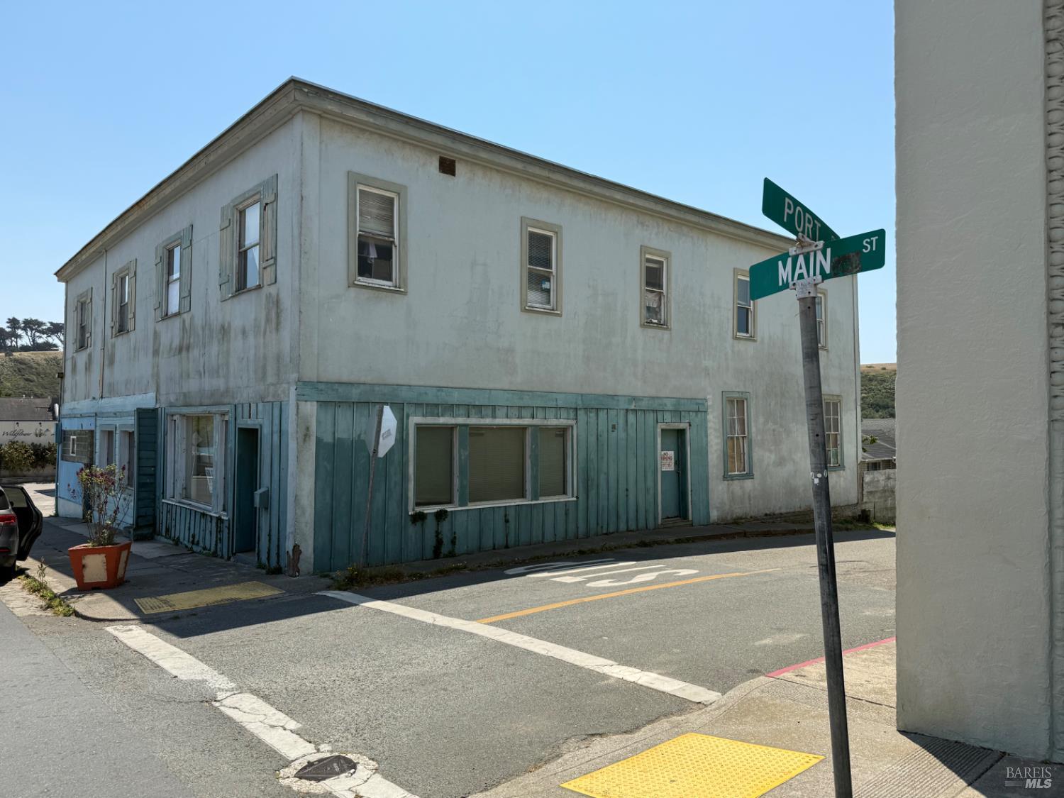24900 Highway 1 Point Arena, CA 95468 - Photo 2 of 20 a front view of a house with a garage