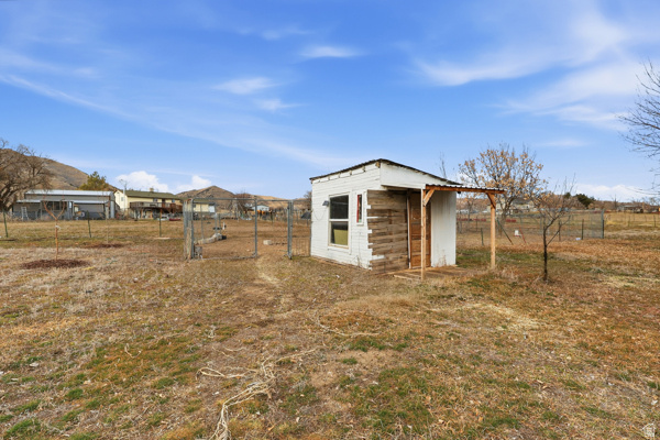 25615 Main Street Portage, UT 84331 - Photo 40 of 42 View of outdoor structure featuring a view of countryside and a gate. There are 2 plum, 2 apple, 2 pear and one cherry tree located on the property