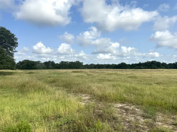 a view of a golf course with green space