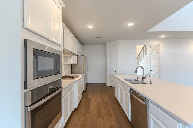 a view of a livingroom with a ceiling fan and window