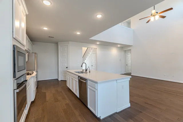 a bathroom with a double vanity sink mirror and