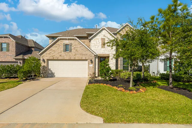 a kitchen with a sink stove and refrigerator