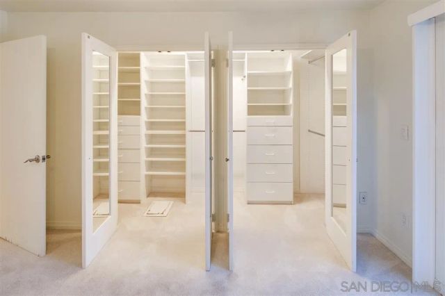 a bathroom with a shower and a glass door