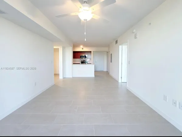 a view of a kitchen with a sink and a window