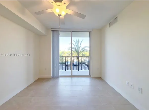 a view of an empty room with a window