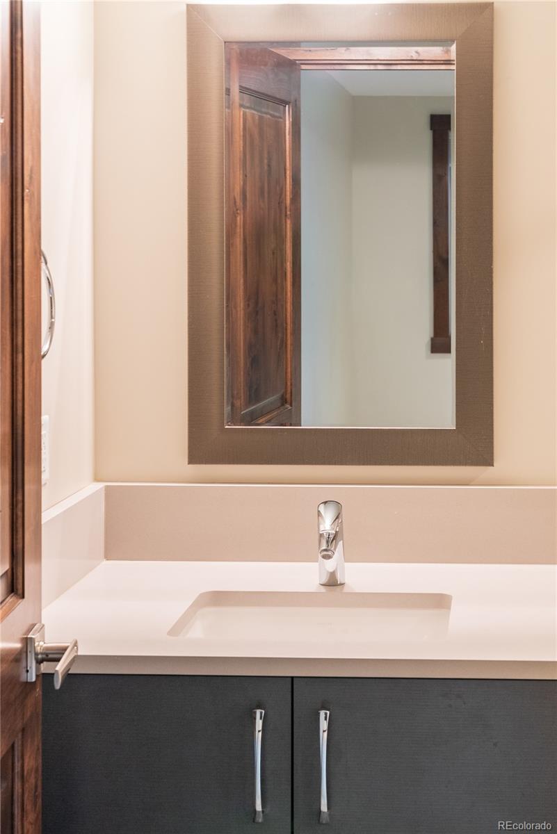 2464 Powderhorn Lane Boulder, CO 80305 - Photo 24 of 40 a bathroom with a sink and a mirror